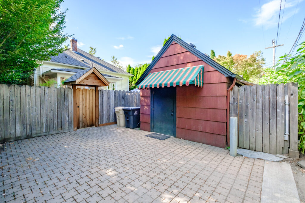 Paved alley behind the cottage with private off-street parking for one car in Corvallis