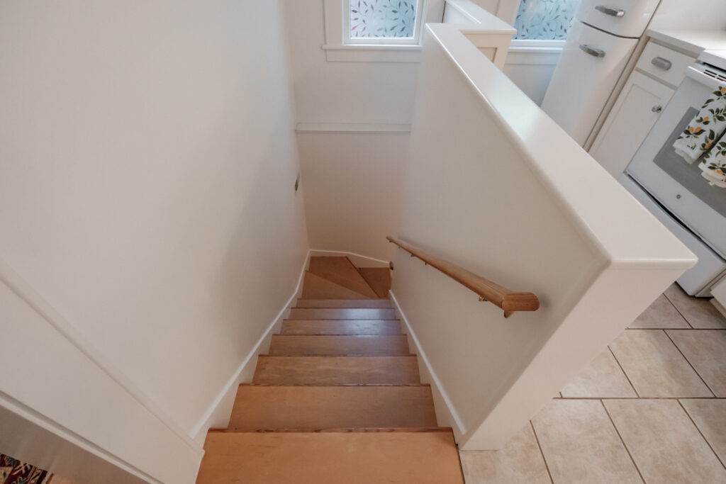 Interior staircase leading down to the basement laundry room
