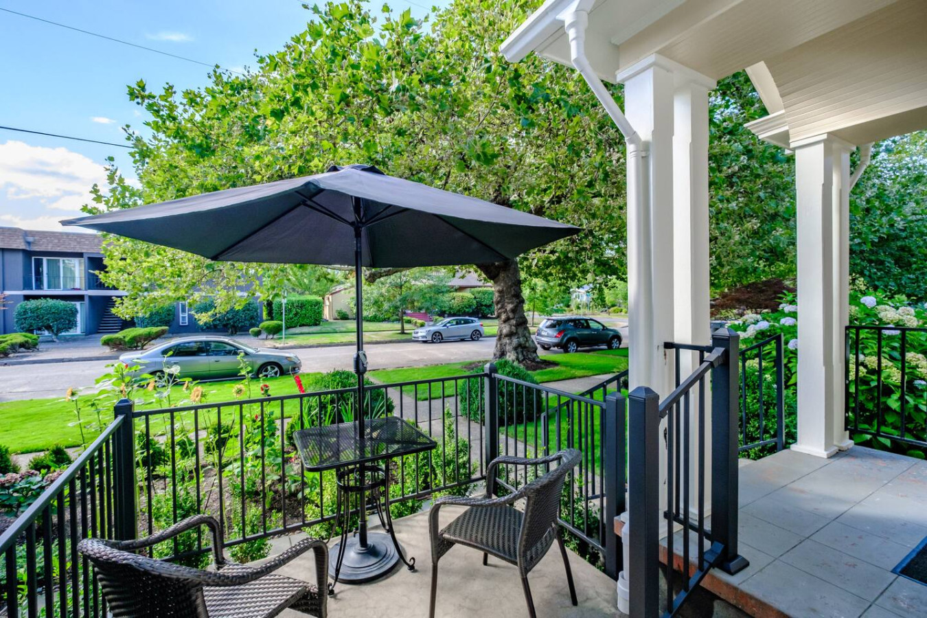 The view from the front porch over the garden and the tree-lined street in downtown Corvallis