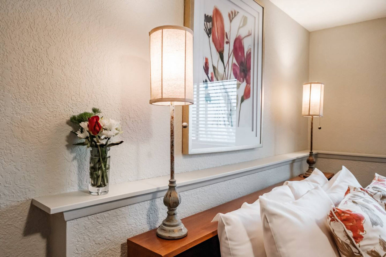 Unwind with thoughtful bedside lighting and a cozy nighttime setup.